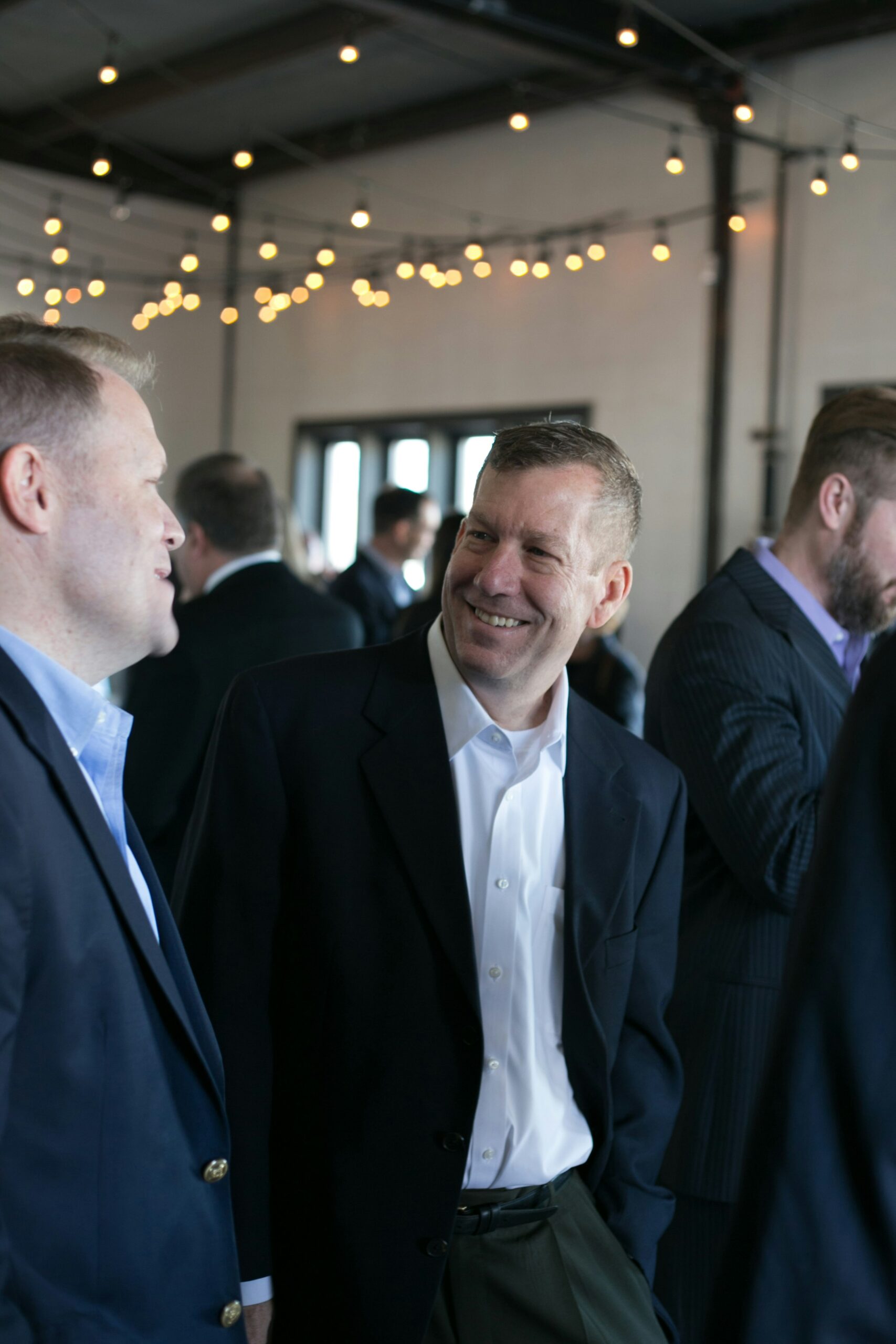 Business professionals networking at a corporate HR event in the UK